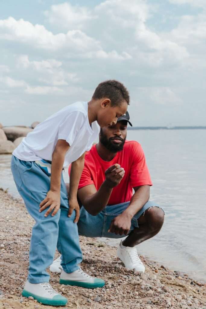 father and son exploring ocean